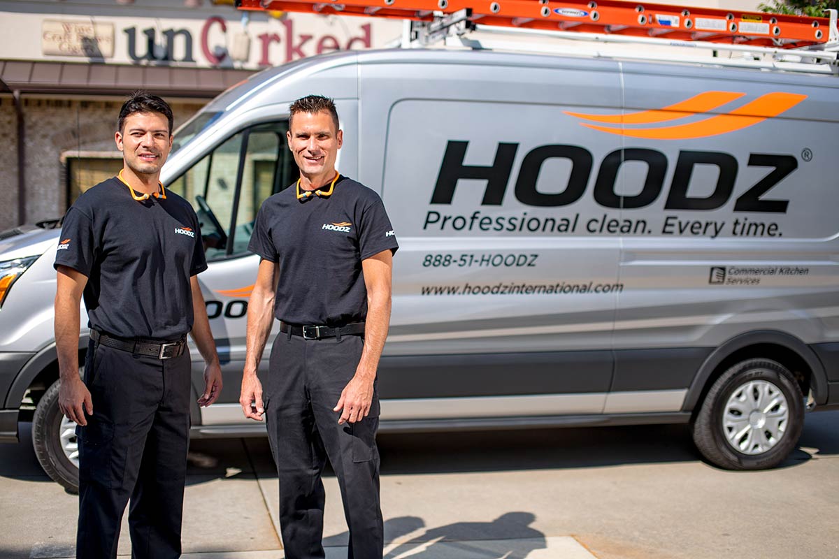 HOODZ franchise techs in front of company van