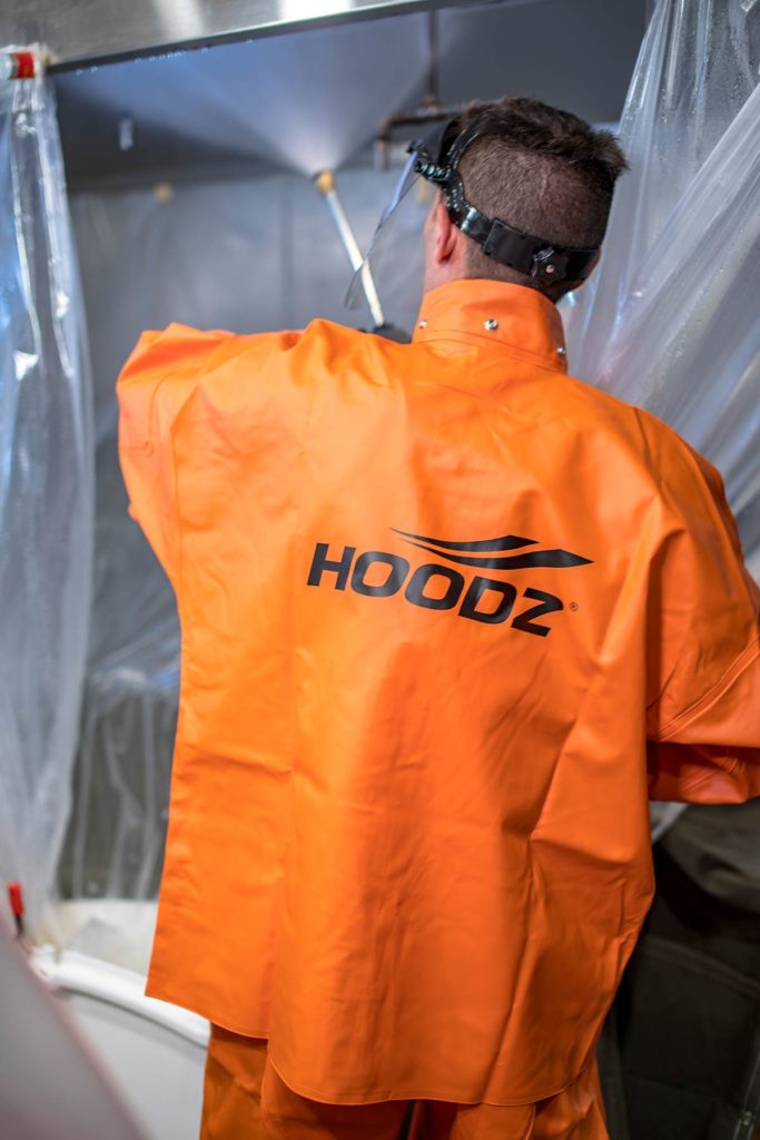 HOODZ tech spraying down hood