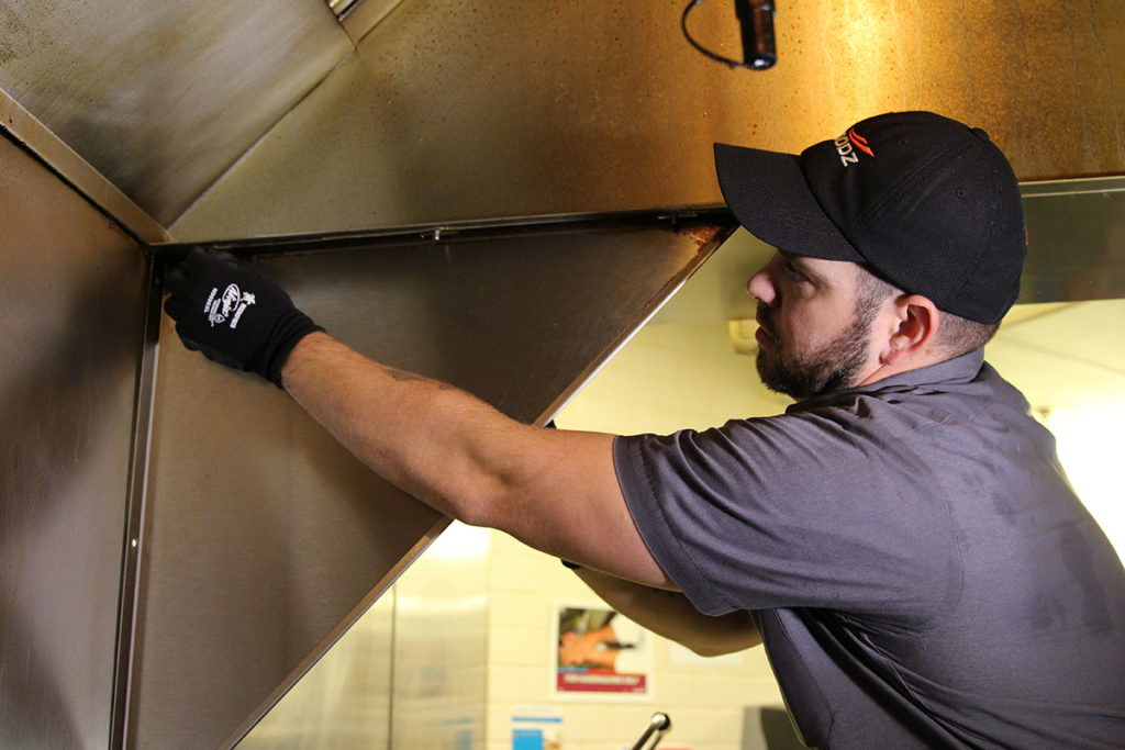HOODZ kitchen cleaning franchise tech cleaning a hood kitchen exhaust cleaning franchise